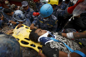 Rescue crew pulls survivor from rubble 5 days after Nepal quake.